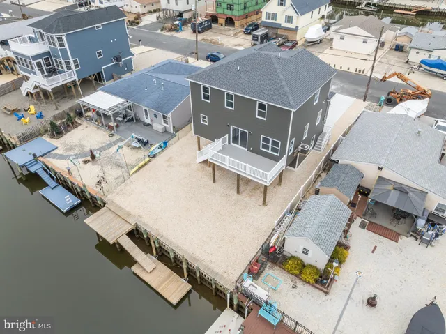 an aerial view of a house with a lake view
