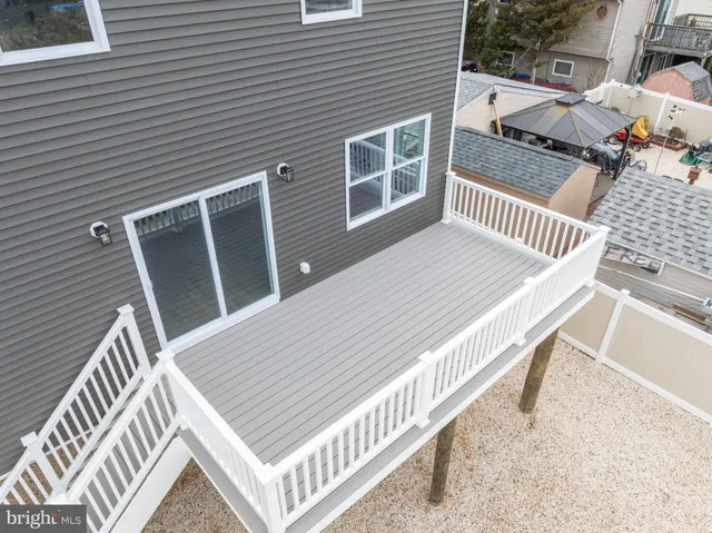 an aerial view of a house with lake view