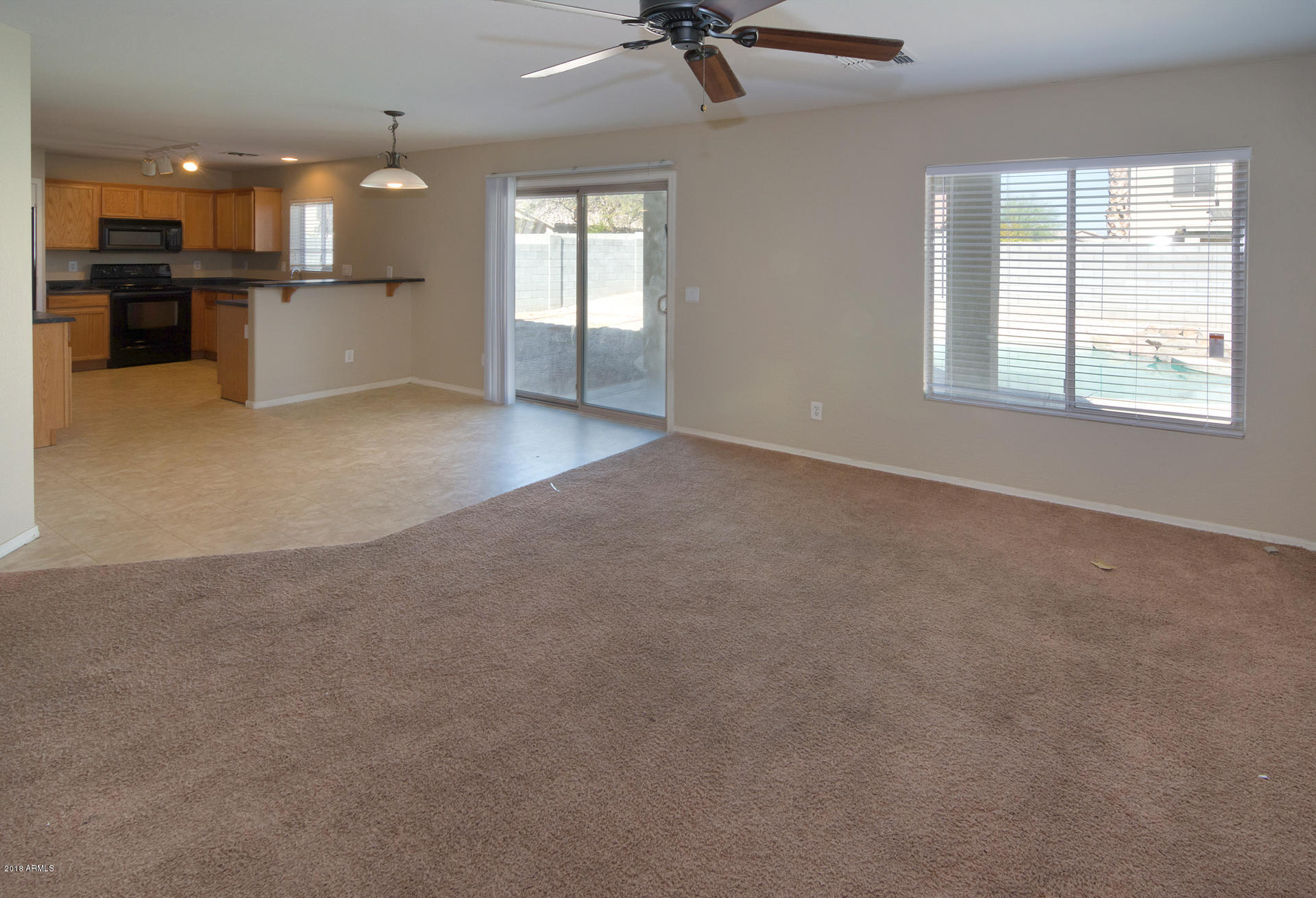 17756 West Calavar Road Surprise, AZ 85388 - Photo 16 of 38 Living Room Kitchen