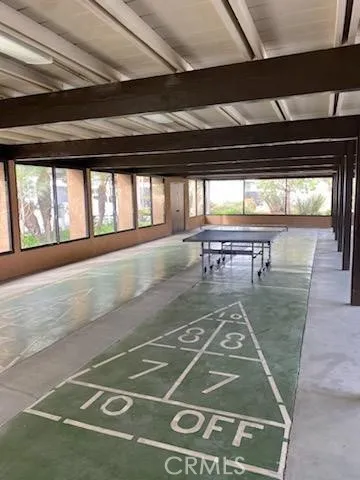 a view of a swimming pool with an outdoor seating