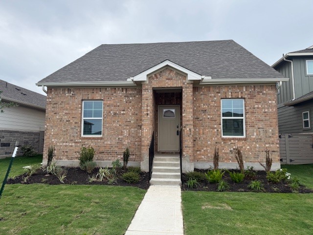 117 Maple Hedge Road Hutto, TX 78634 - Photo 1 of 7 a front view of a house with a yard