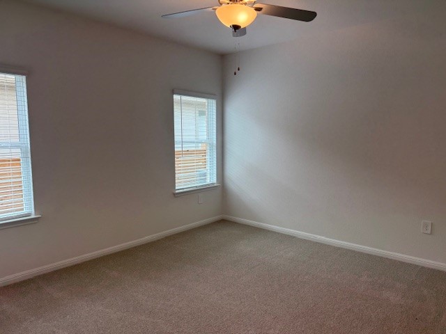 117 Maple Hedge Road Hutto, TX 78634 - Photo 3 of 7 an empty room with windows