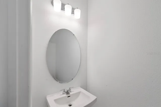 a bathroom with a toilet a sink and bathtub