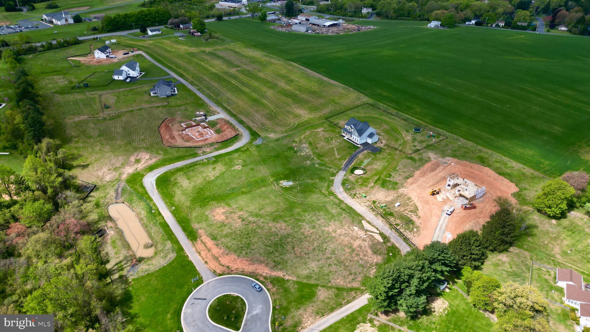 an aerial view of a play ground and trees all around