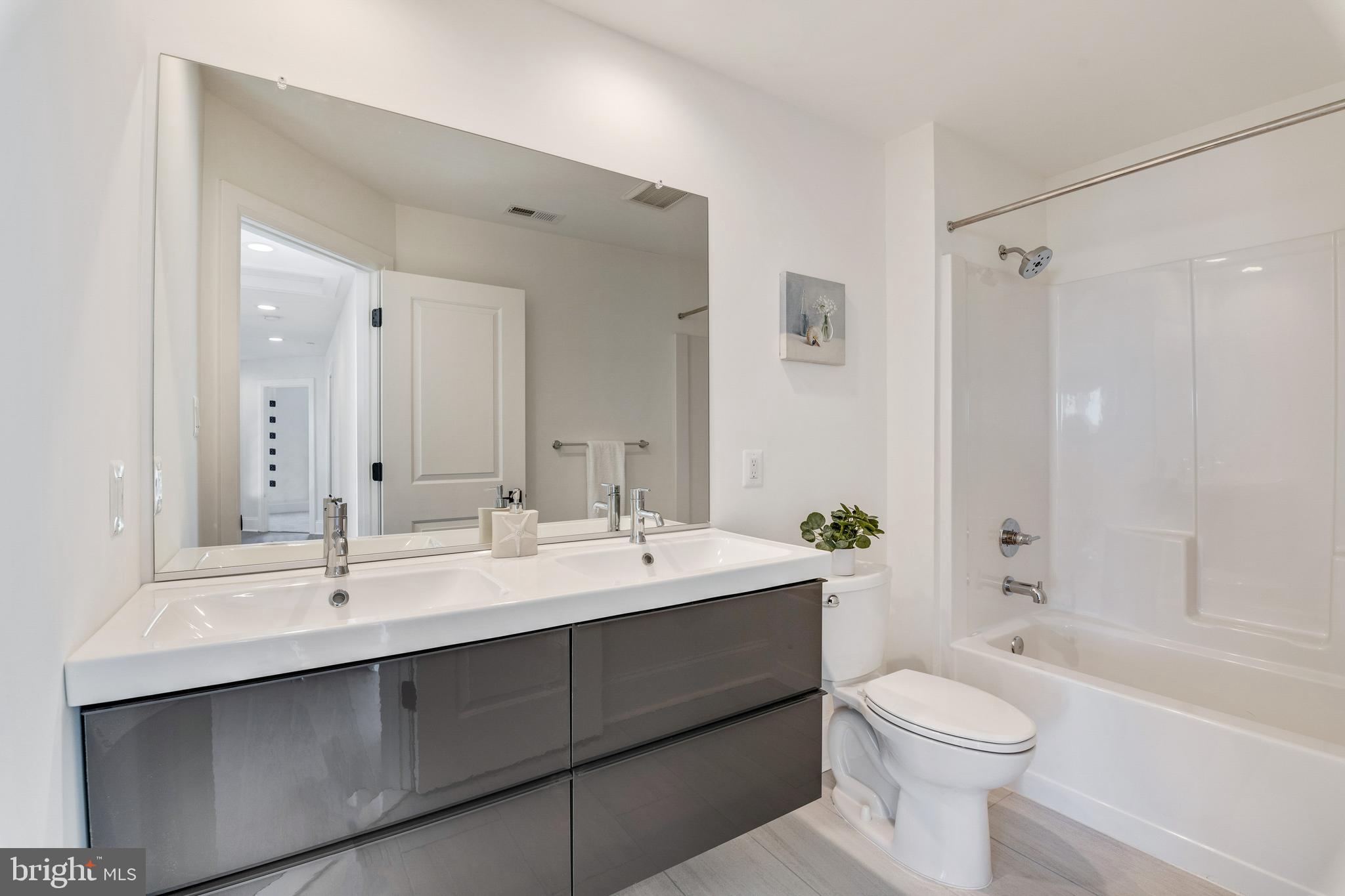 Lot 5 Arden Drive Fallston, MD 21047 - Photo 3 of 11 a bathroom with a double vanity sink toilet and shower