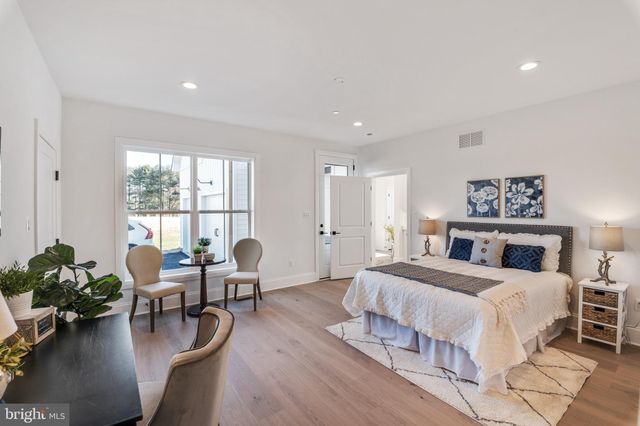 a bedroom with a bed and furniture