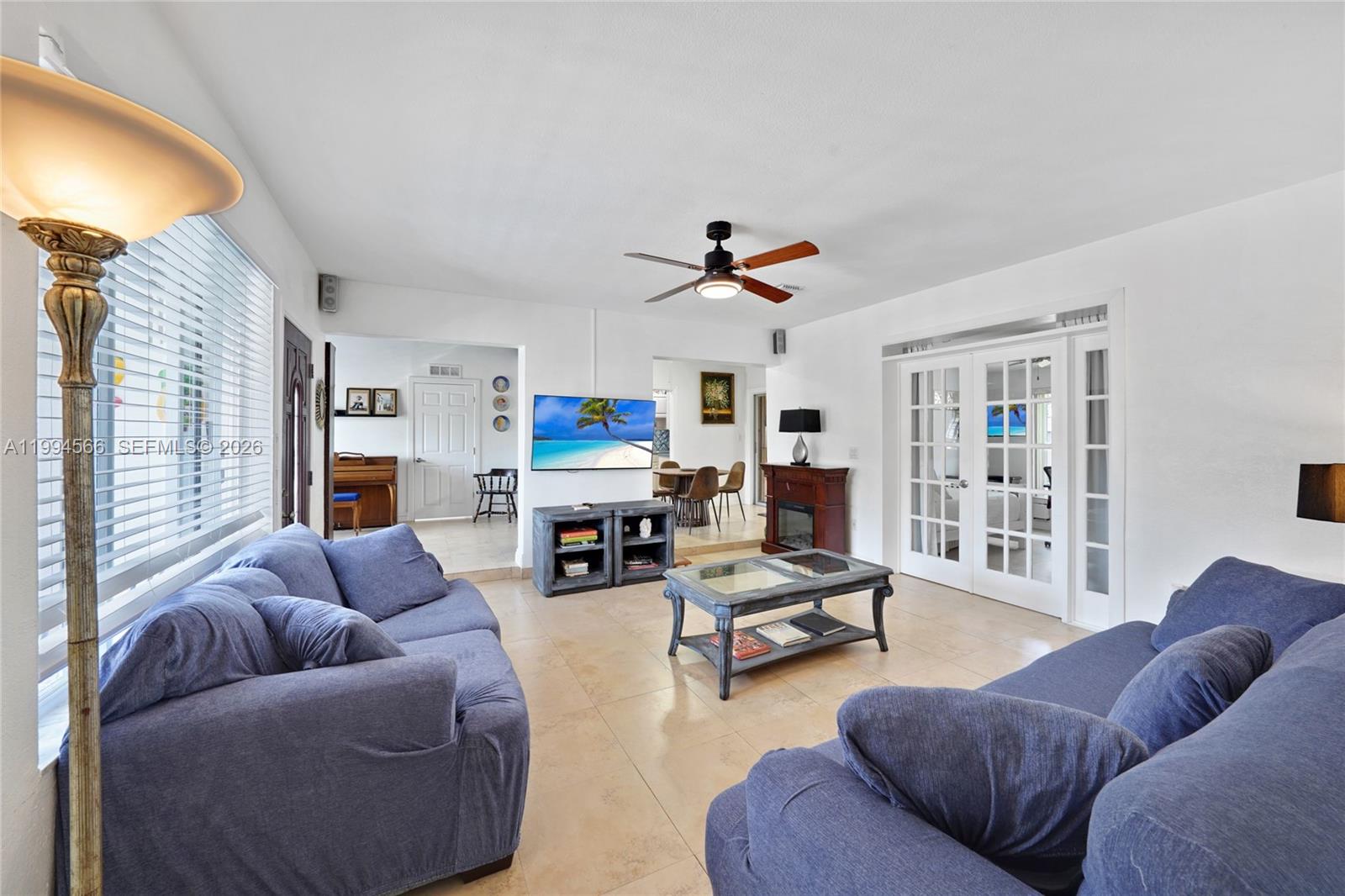 2834 Southwest 33rd Avenue Miami, FL 33133 - Photo 19 of 36 a living room with furniture and a window