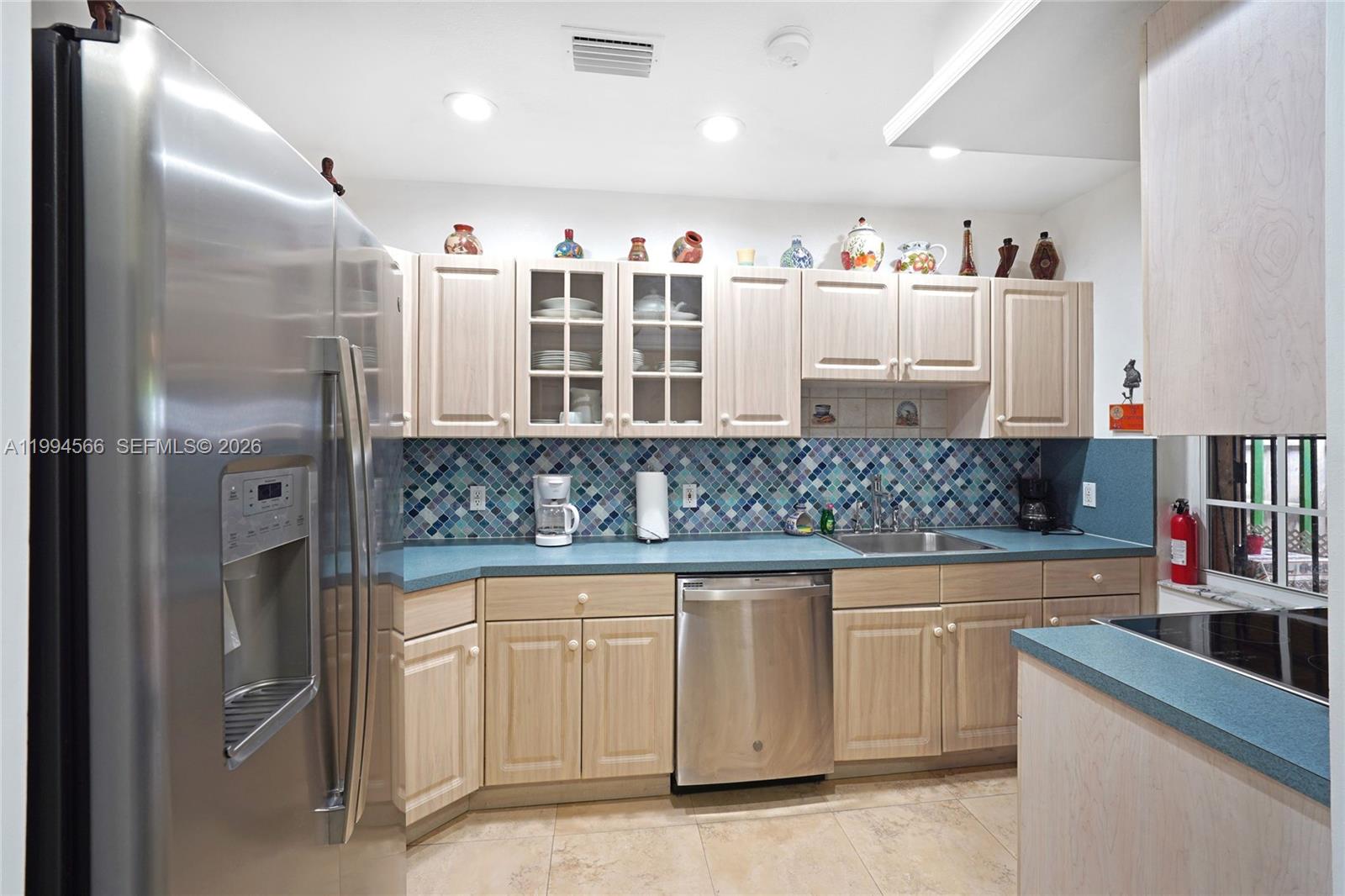 2834 Southwest 33rd Avenue Miami, FL 33133 - Photo 26 of 36 a kitchen with cabinets and window
