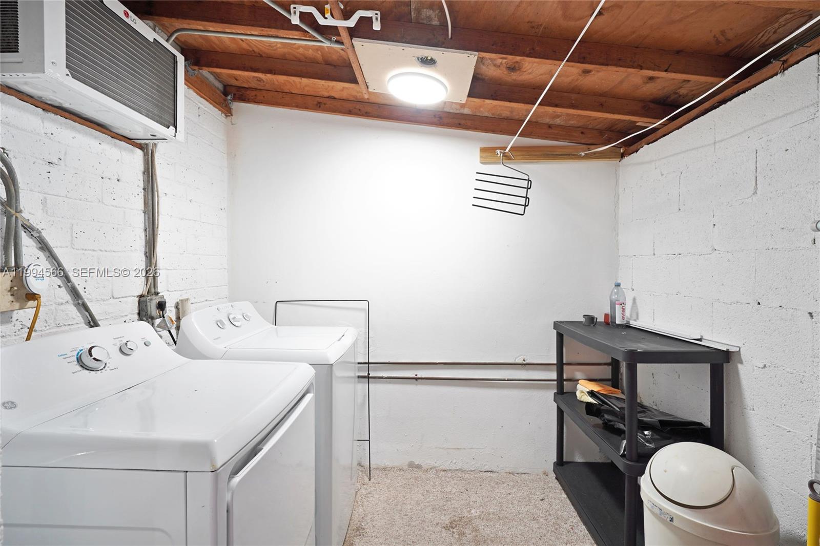 2834 Southwest 33rd Avenue Miami, FL 33133 - Photo 35 of 36 a bathroom with a sink a toilet and a mirror