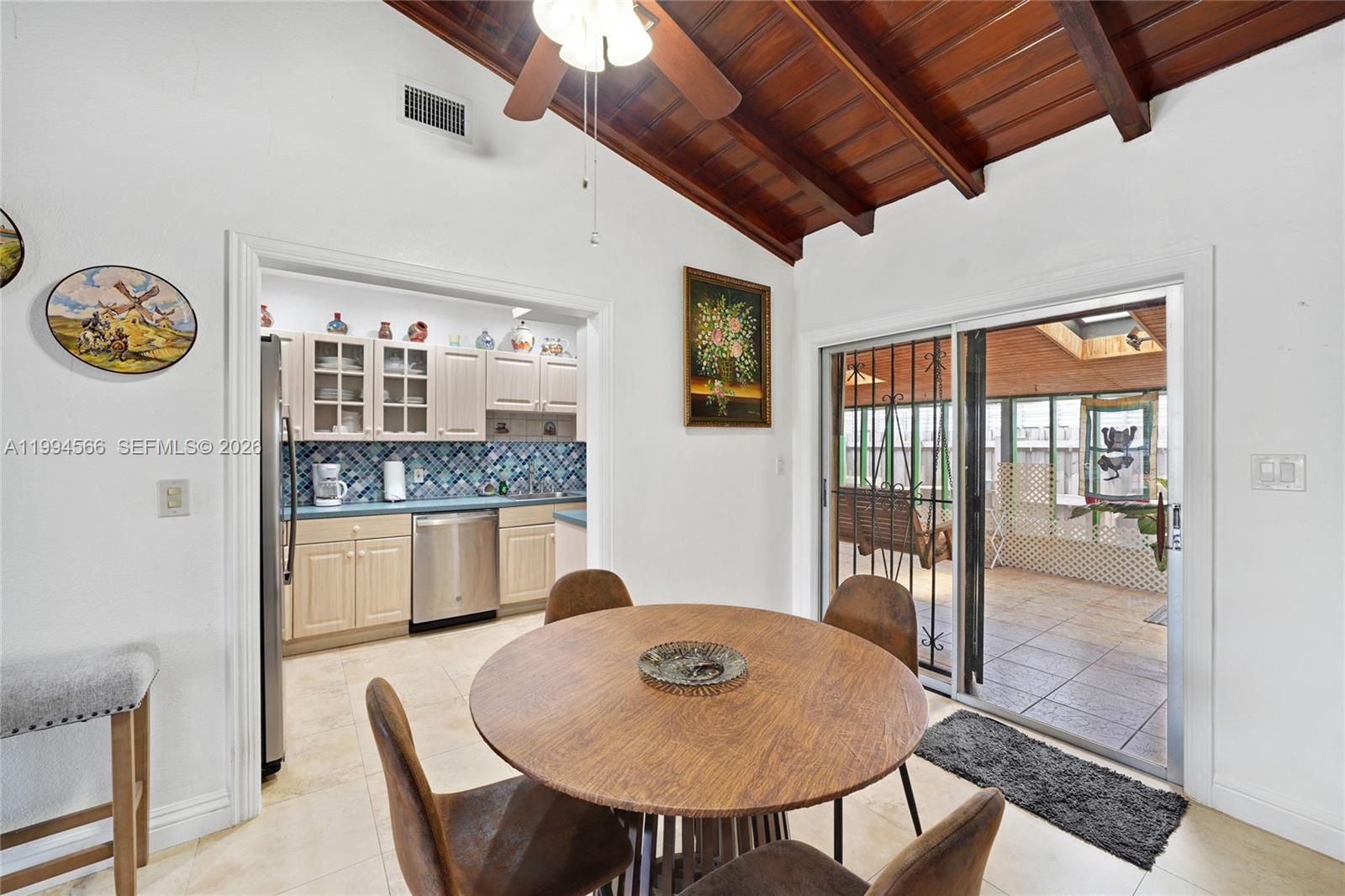 2834 Southwest 33rd Avenue Miami, FL 33133 - Photo 8 of 36 a view of a dining room with furniture window and outside view