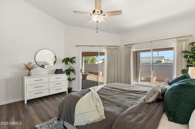 a bedroom with a bed and chandelier