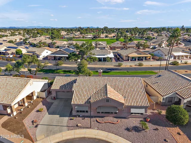 an aerial view of a house with a ocean view