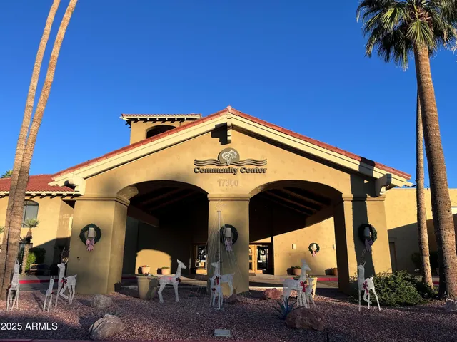 a view of a patio with table and chairs and potted plants