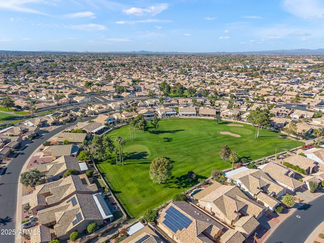 an aerial view of a residential apartment building with a yard