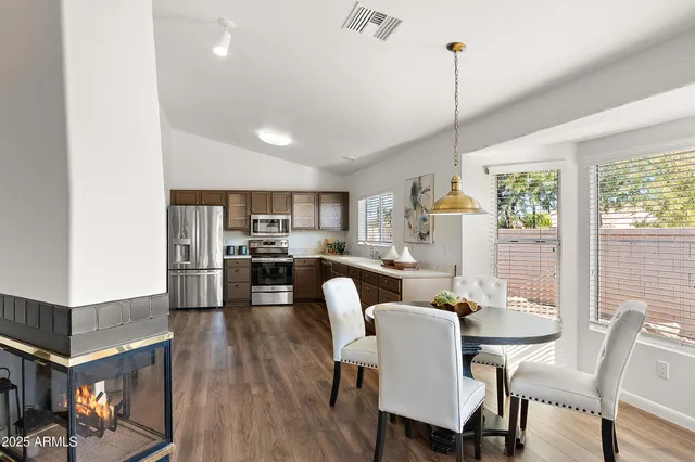a view of a dining room with furniture window and wooden floor