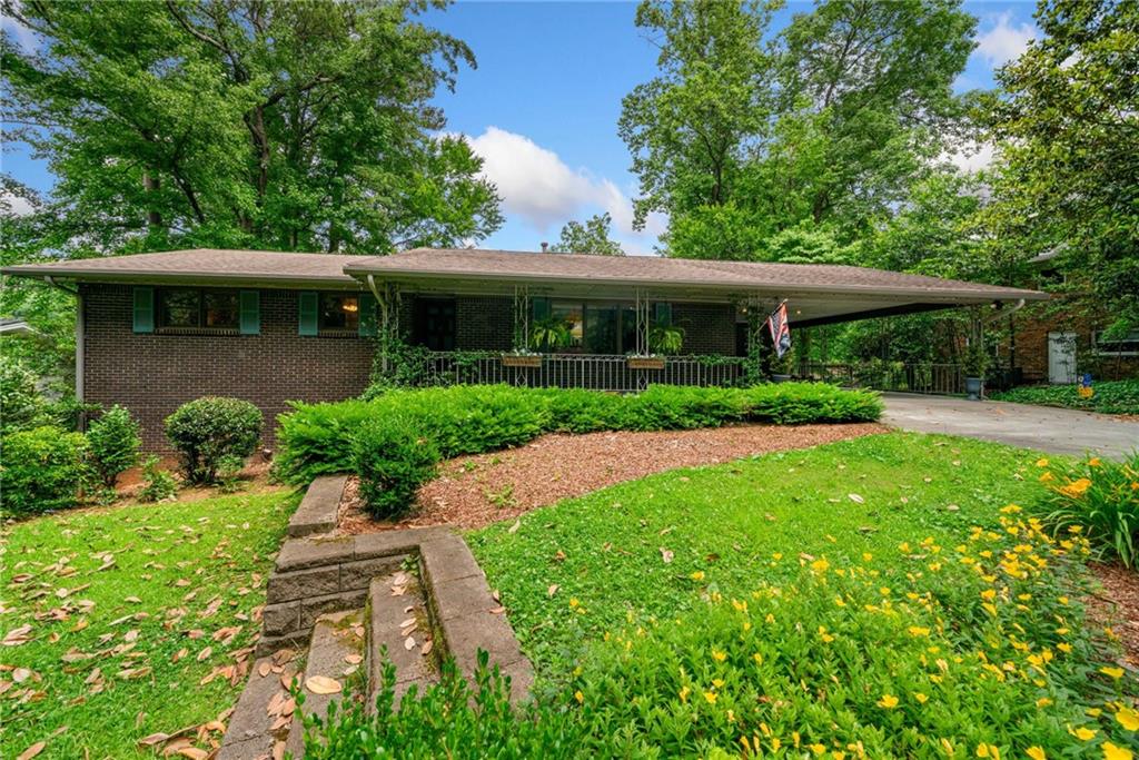 a front view of a house with garden