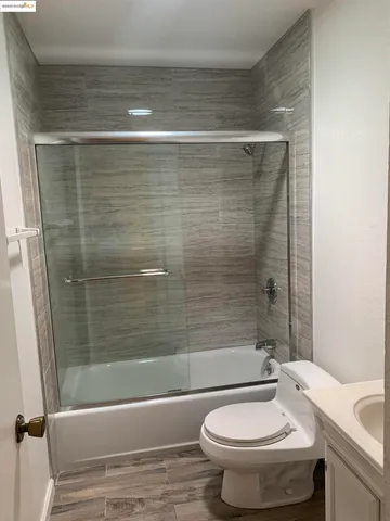 a bathroom with a sink a toilet and a bathtub