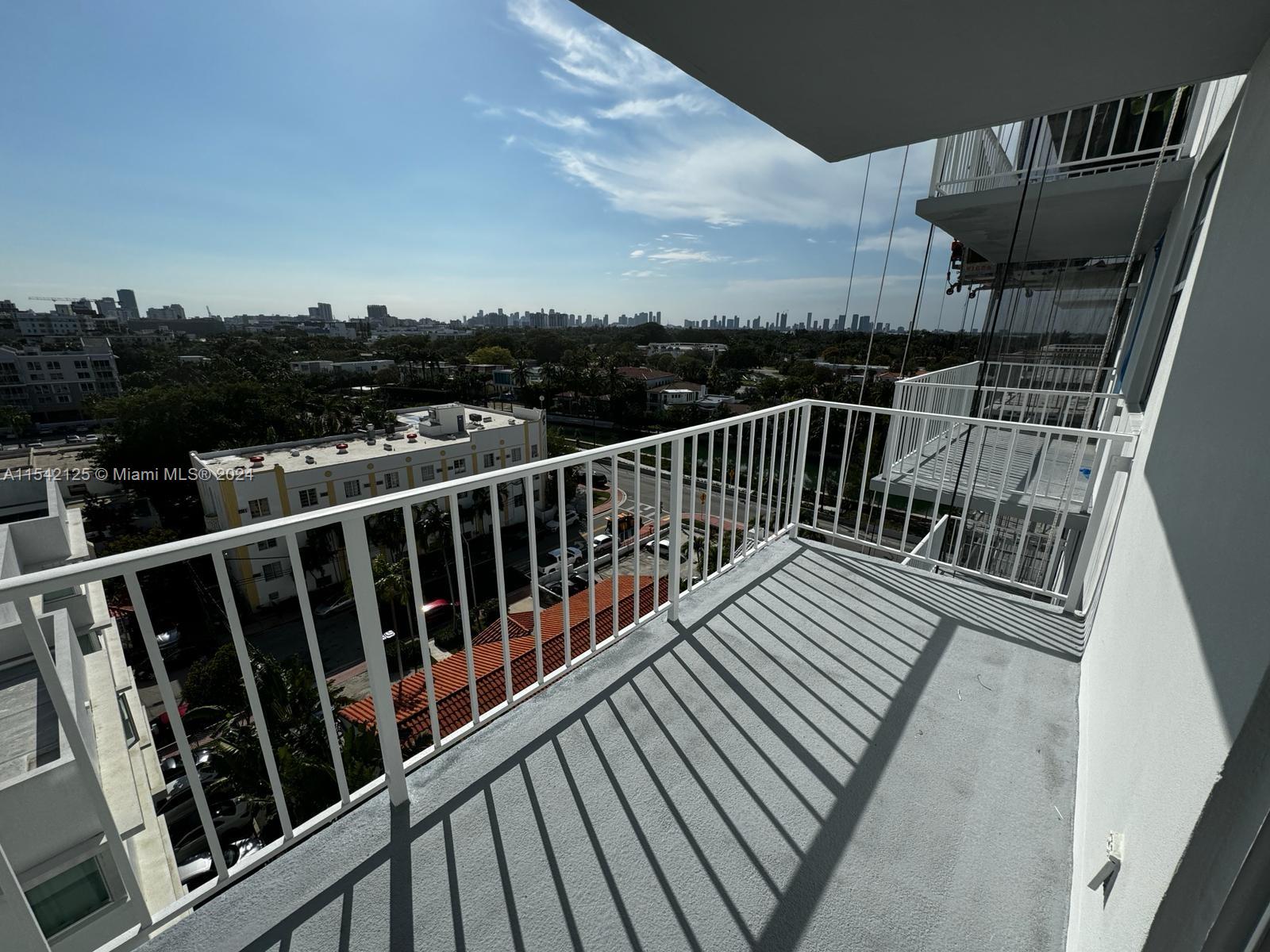 a view of balcony with wooden floor and city view