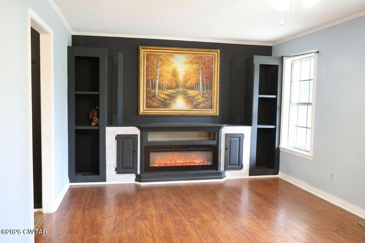 513 Viar Road Dyersburg, TN 38024 - Photo 9 of 37 a view of an empty room with window and fire place