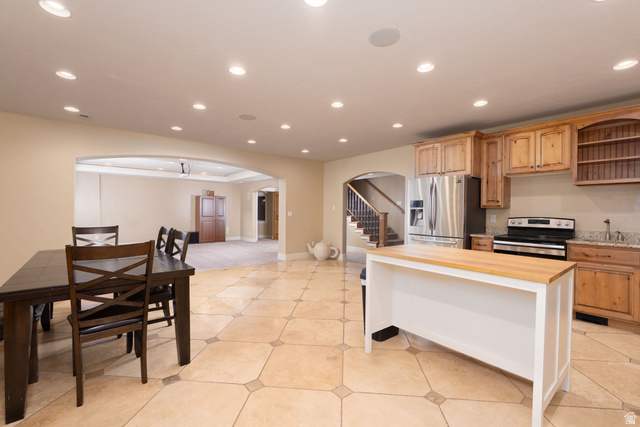 687 South 2080th Street East Springville, UT 84663 - Photo 29 of 149 Spacious lower level featuring patterned tile flooring, an arched doorway, and recessed lighting