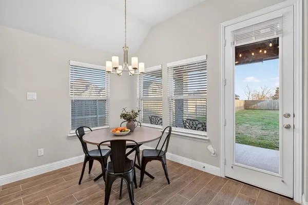 a dining room with furniture and window