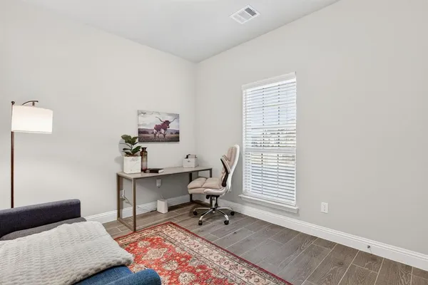 a workspace with furniture and a window