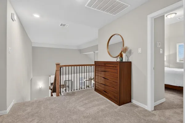 a view of a room with furniture entryway and wooden floor