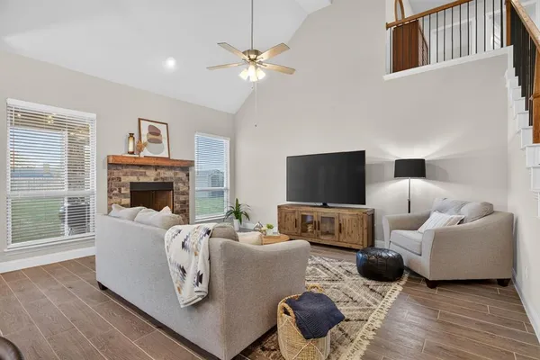 a living room with furniture and a fireplace