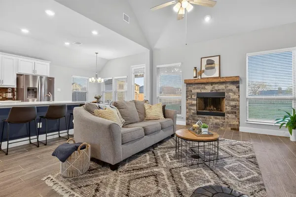 a living room with furniture and a fireplace