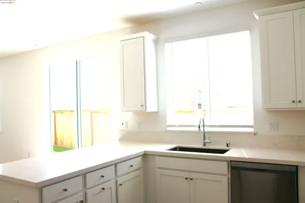 a bathroom that has a glass shower door