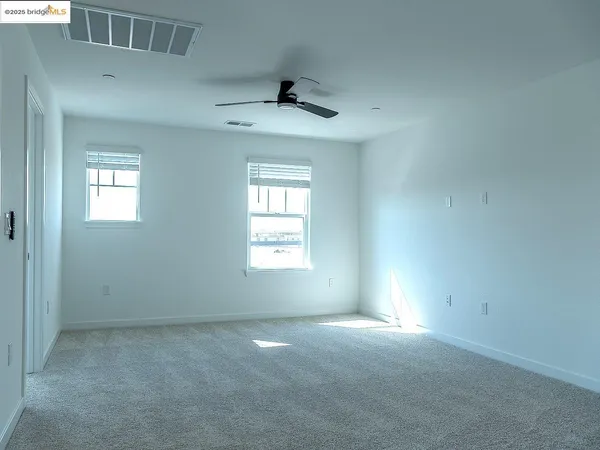 a view of backyard with large windows
