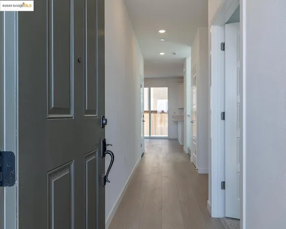 an empty room with wooden floor