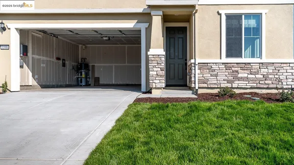 a kitchen with stainless steel appliances a sink a stove a microwave and cabinets