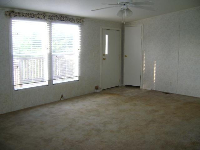 1971 Lick Ridge Road Northeast Check, VA 24072 - Photo 2 of 6 an empty room with a empty space and windows