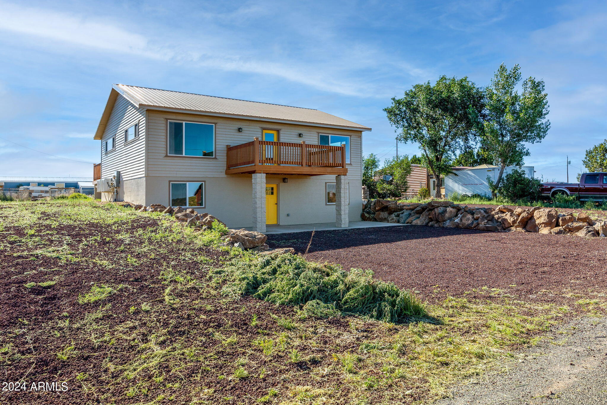 157 Frontage Road Concho, AZ 85924 - Photo 2 of 69 a front view of a house with a yard