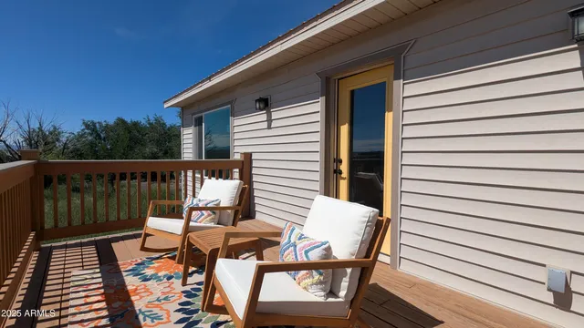 a kitchen with stainless steel appliances granite countertop a sink a stove a refrigerator and white cabinets