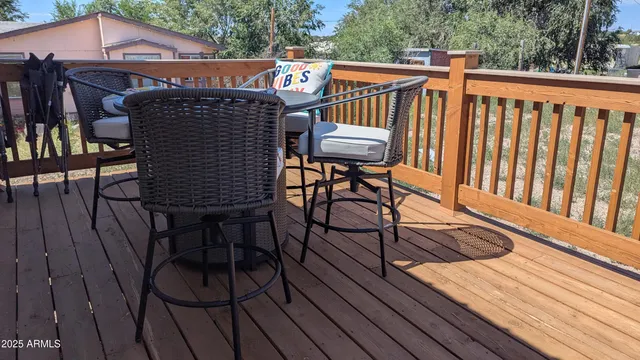 an empty room with closet and a ceiling fan