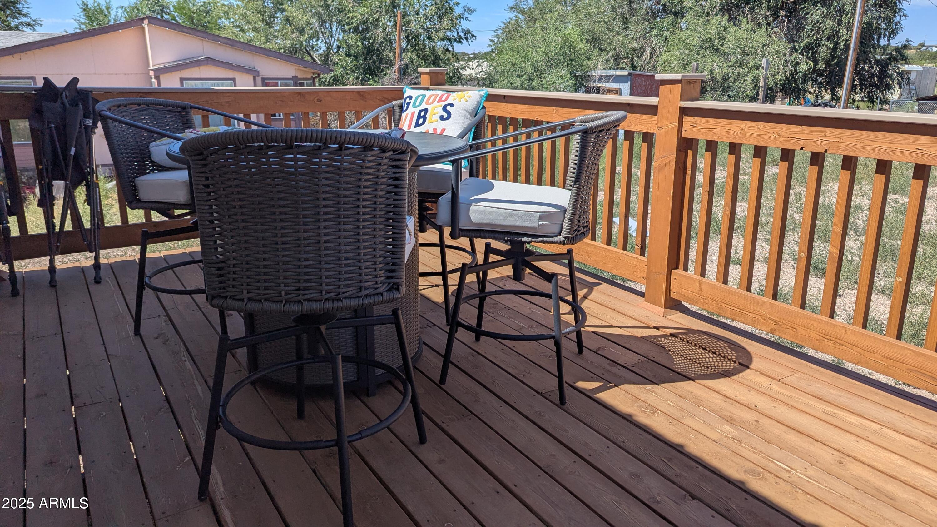 157 Frontage Road Concho, AZ 85924 - Photo 29 of 69 a view of a roof deck with wooden floor and fence