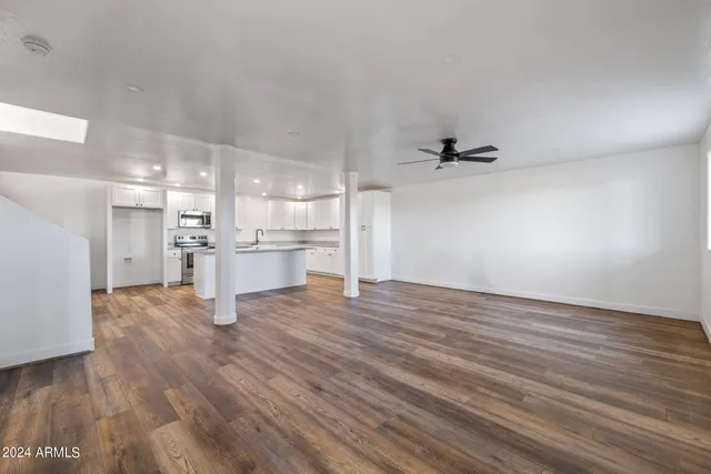a bathroom with double sink and a mirror