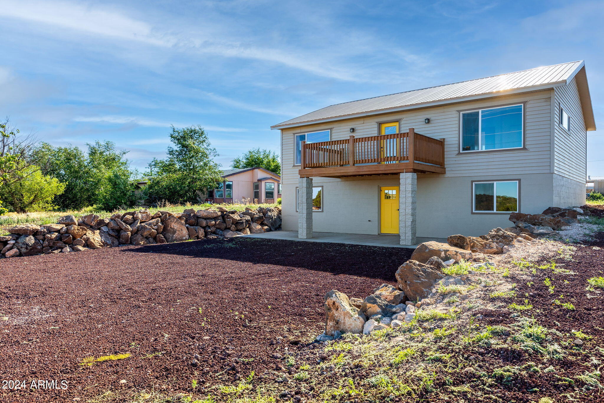 157 Frontage Road Concho, AZ 85924 - Photo 3 of 69 a front view of a house with a yard