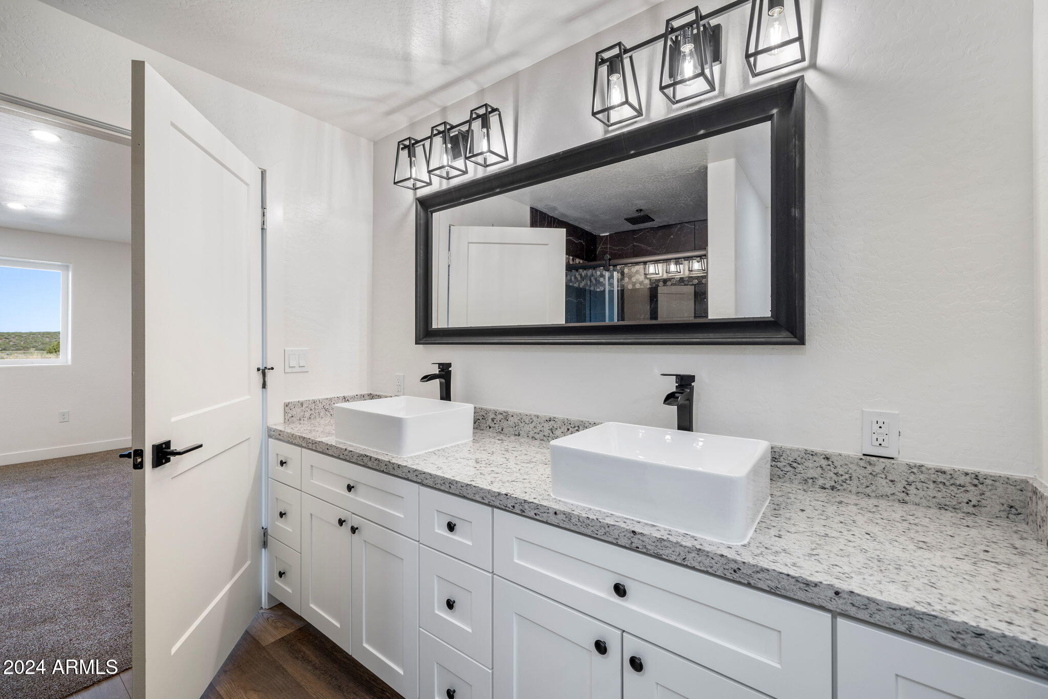 157 Frontage Road Concho, AZ 85924 - Photo 40 of 69 a bathroom with double sink and a mirror