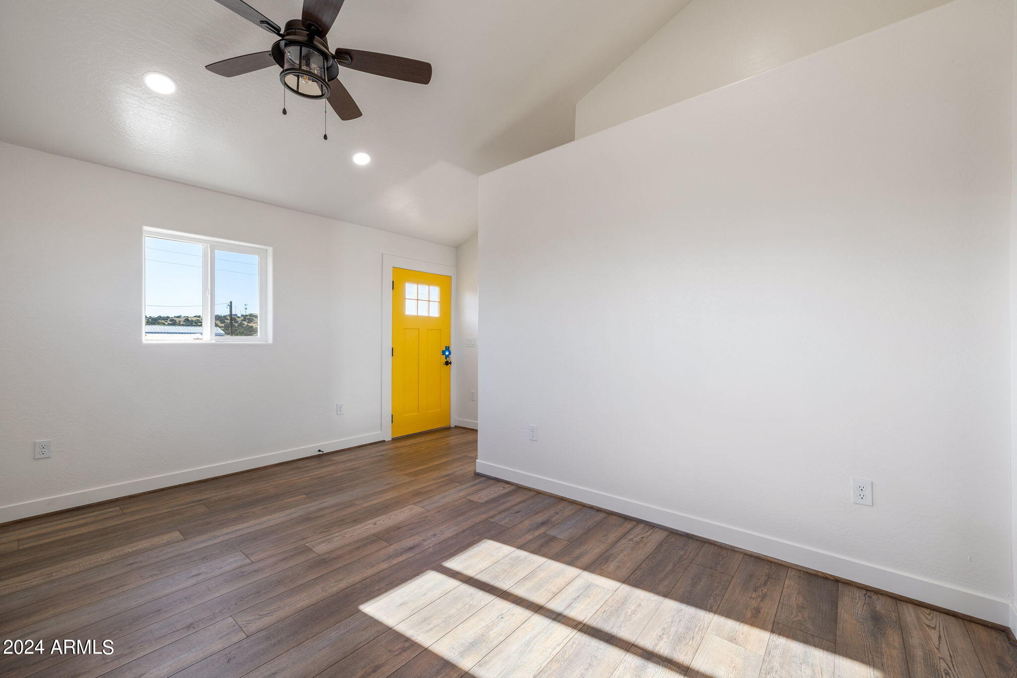 157 Frontage Road Concho, AZ 85924 - Photo 44 of 69 an empty room with a window and a ceiling fan