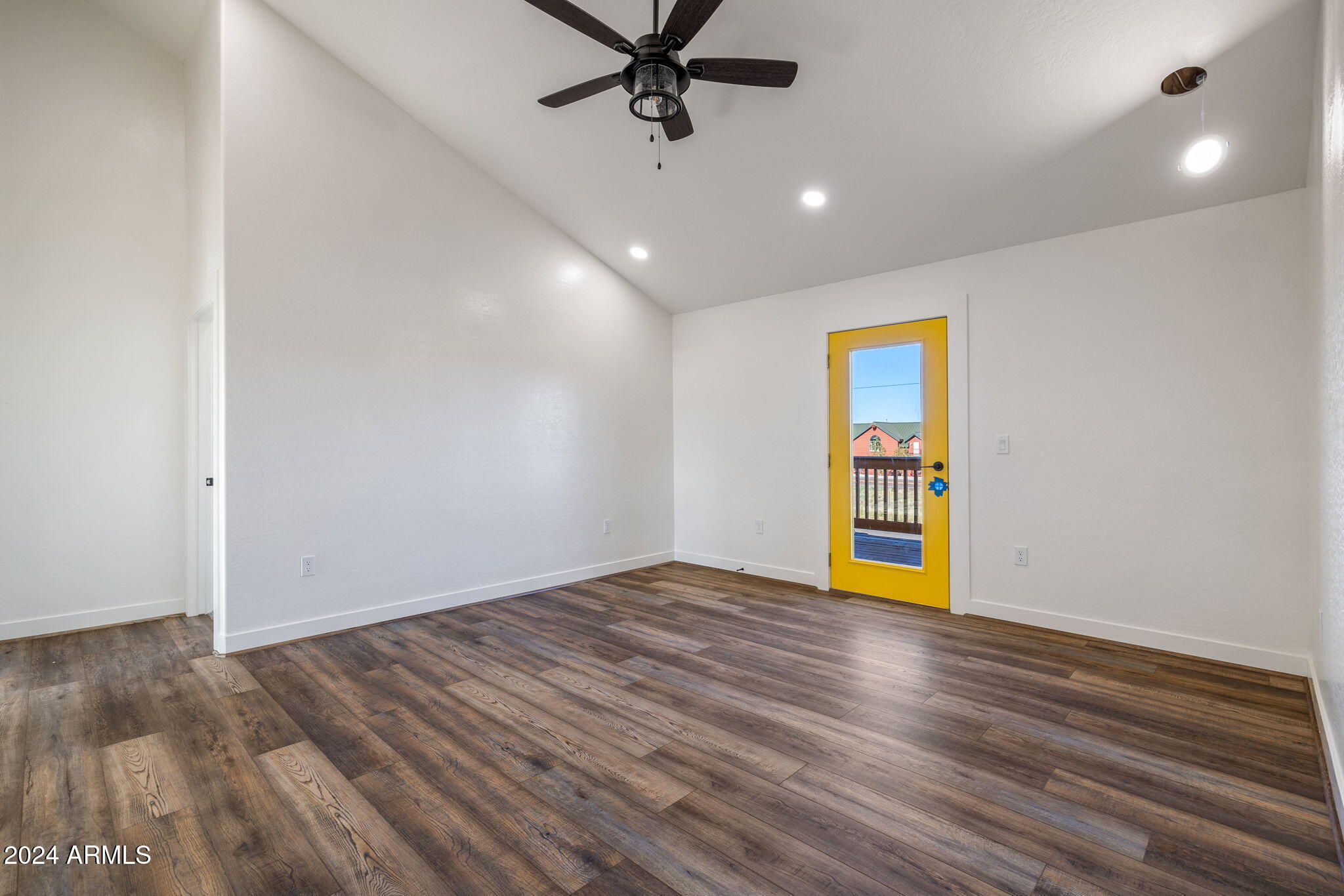 157 Frontage Road Concho, AZ 85924 - Photo 46 of 69 a view of an empty room with window and wooden floor
