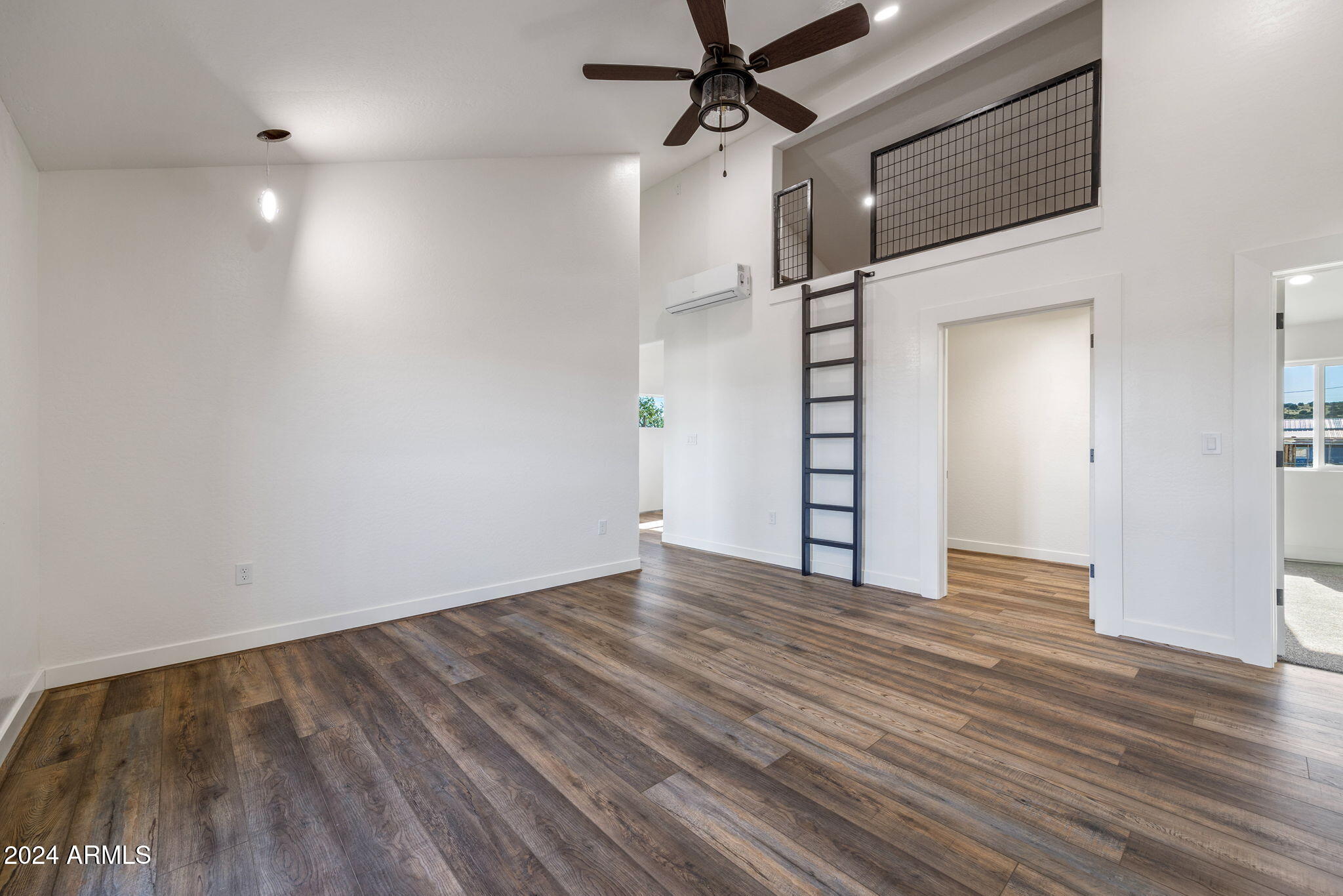 157 Frontage Road Concho, AZ 85924 - Photo 47 of 69 a view of empty room with wooden floor and fan