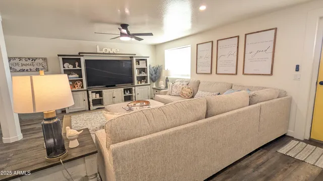 a living room with furniture and a flat screen tv