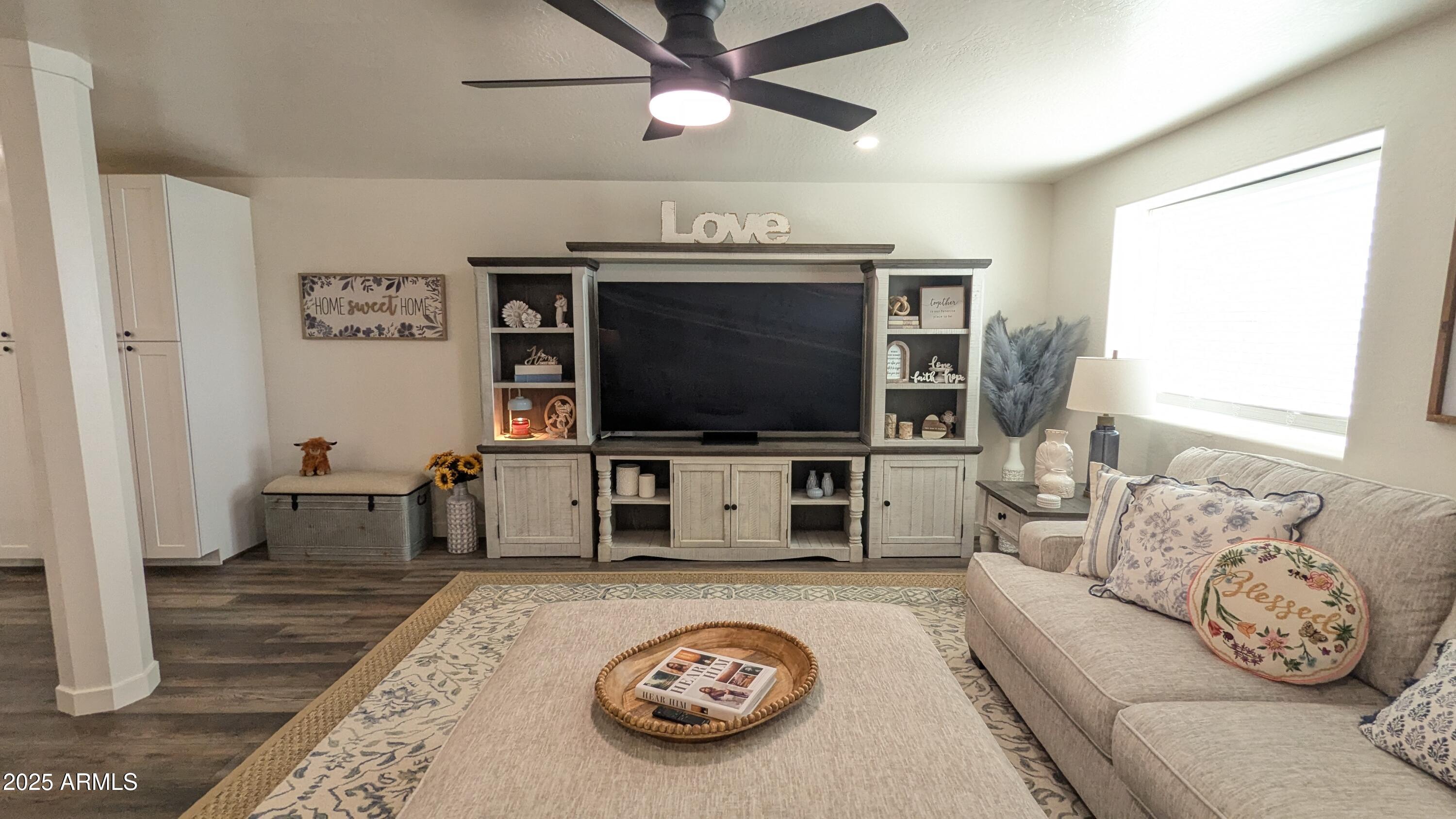 157 Frontage Road Concho, AZ 85924 - Photo 10 of 69 a living room with furniture and a flat screen tv