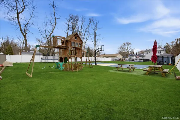 a view of a park with large trees