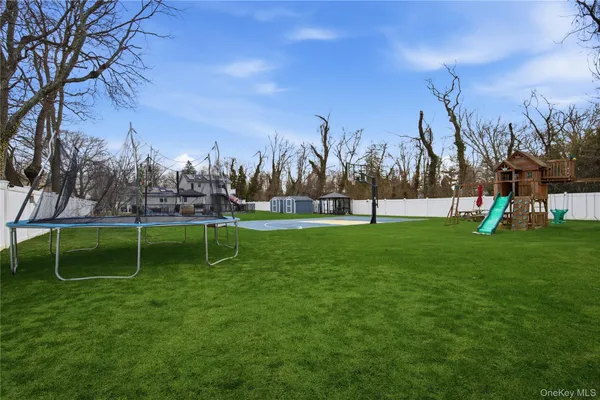 a view of a big building with wooden floor and fence