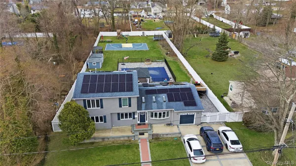 an aerial view of multiple houses with yard