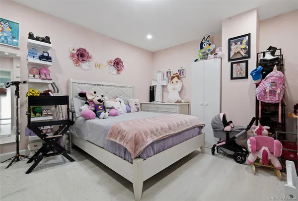 a bed room with a bed and a chair